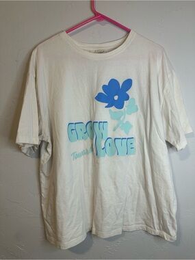Cream Colored Graphic Tee with Blue Flower